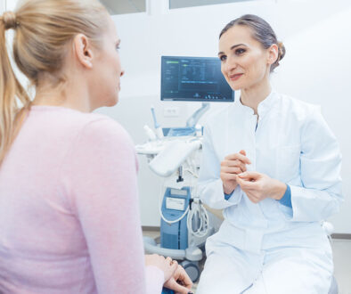 A Gynecologist Sitting In Front Of A Patient Talking To Her Does A Pap Smear Test Hurt